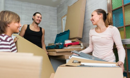 Removal team planning a home move in Manor Park with boxes and furniture